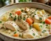 A hearty bowl of simple chicken stew with tender chicken, vegetables, and savory broth.