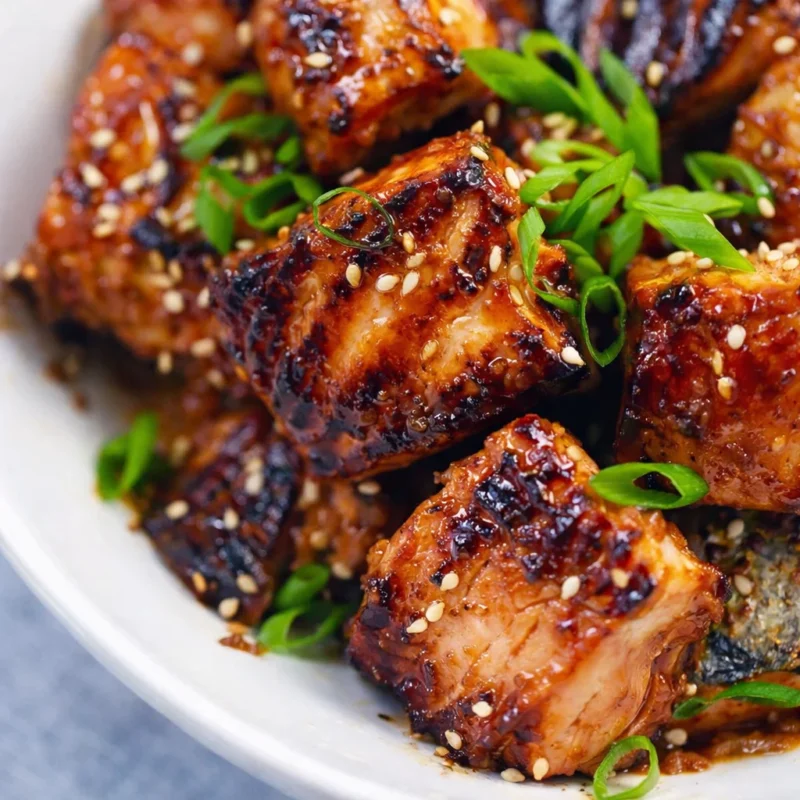 Delicious cubed salmon bites ready to be served with sesame soy sauce.