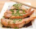 Sticky glazed salmon pieces with sesame seeds and green onions, similar to candied salmon