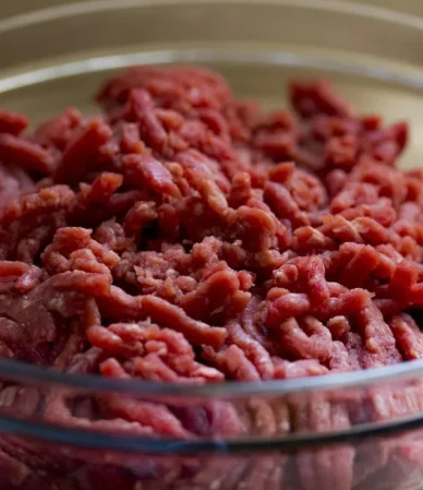 How long does ground beef last in the fridge: fresh raw ground beef like this in a glass bowl keeps 1 to 2 days