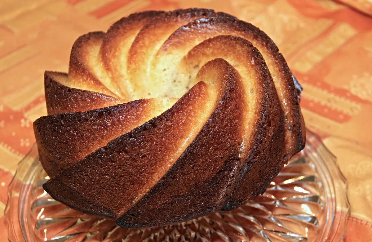 Golden-brown bundt cake turned out of the pan before glazing