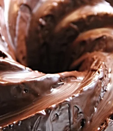 Close-up of a glossy chocolate-glazed Bundt cake, the finish for this chocolate pound cake recipe