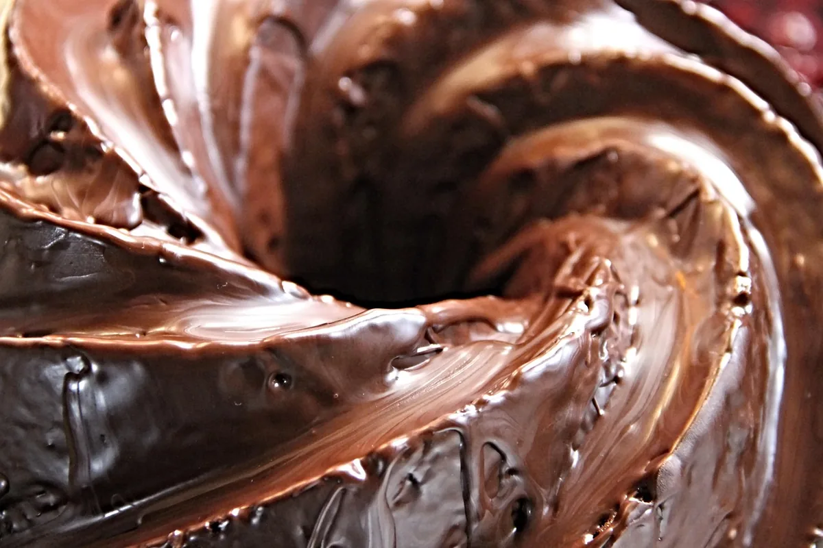 Close-up of a glossy chocolate-glazed Bundt cake, the finish for this chocolate pound cake recipe