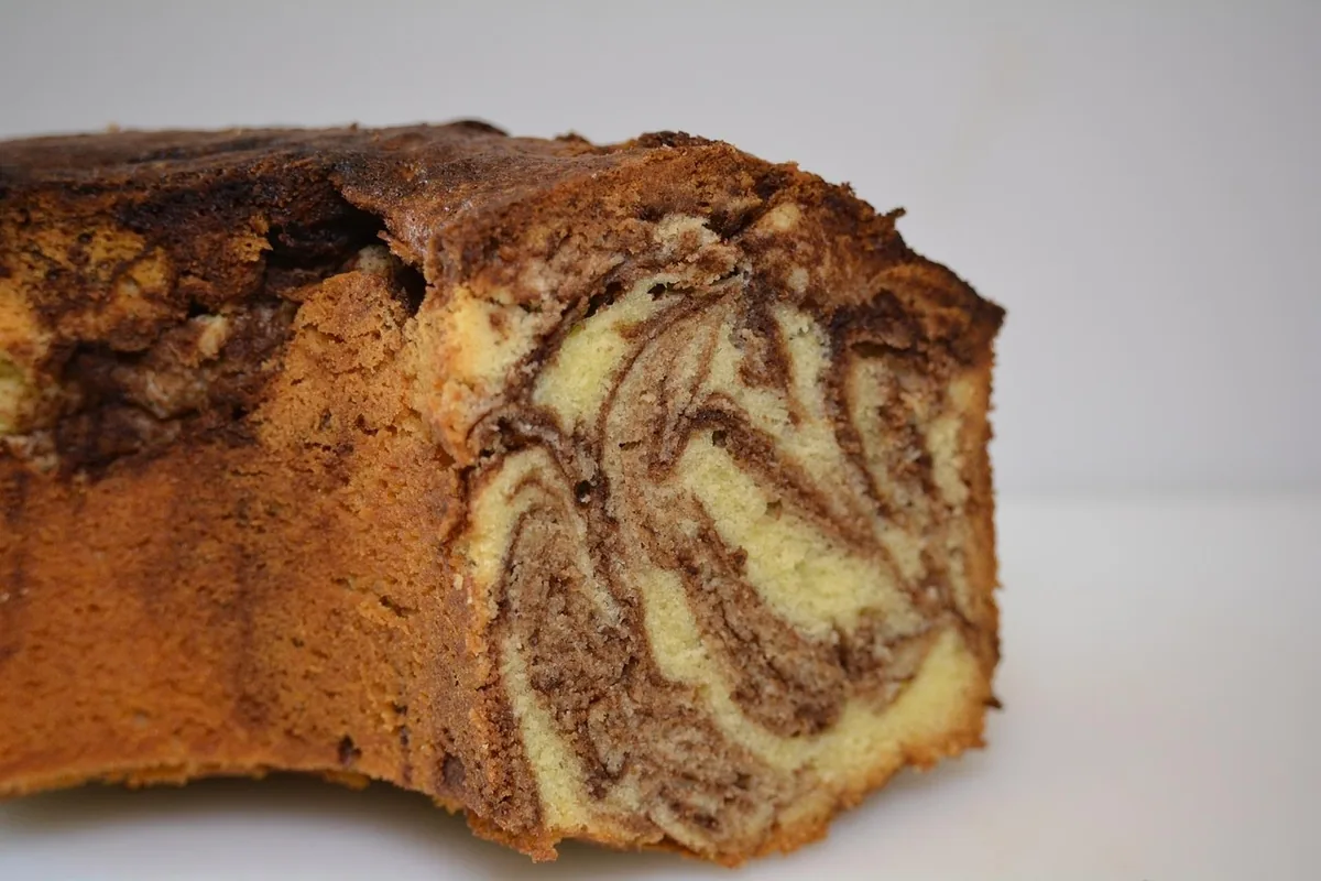 Slice of marble pound cake showing chocolate and vanilla swirls