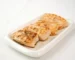 Air fry salmon recipe result: browned, flaky salmon fillet pieces on a white plate
