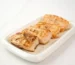 Air fry salmon recipe result: browned, flaky salmon fillet pieces on a white plate