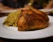 Golden oven baked chicken served on a plate with rice, similar to this oven baked chicken breast