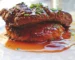 Browned steak in a glossy brown gravy with chives, similar to this cube steak recipe
