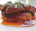 Browned steak in a glossy brown gravy with chives, similar to this cube steak recipe