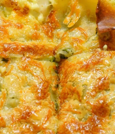 Golden, crisp-topped baked casserole cut into squares, similar to a Ritz cracker chicken casserole