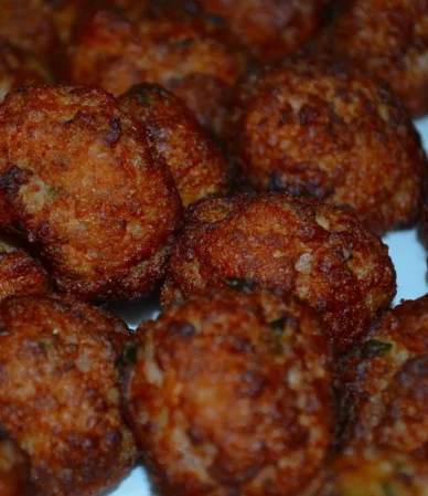 Close-up of browned, crisp-edged beef meatballs, similar to these air fryer meatballs