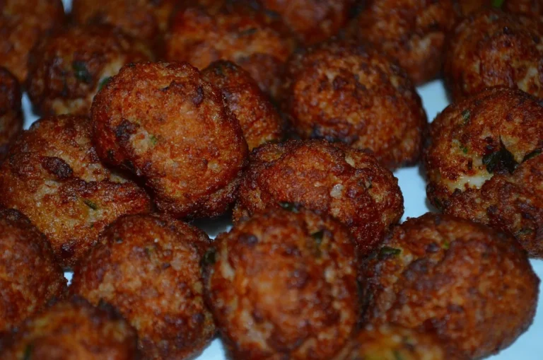 Close-up of browned, crisp-edged beef meatballs, similar to these air fryer meatballs