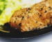 Peppered salmon fillet on a dark plate, similar to the result of how long to bake salmon at 350°F
