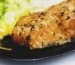 Peppered salmon fillet on a dark plate, similar to the result of how long to bake salmon at 350°F