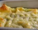 Golden cheese-topped casserole in a white baking dish, similar to this chicken broccoli rice casserole