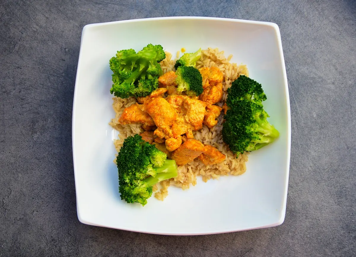 Plate of chicken, rice and broccoli, similar to a serving of chicken and broccoli casserole with rice
