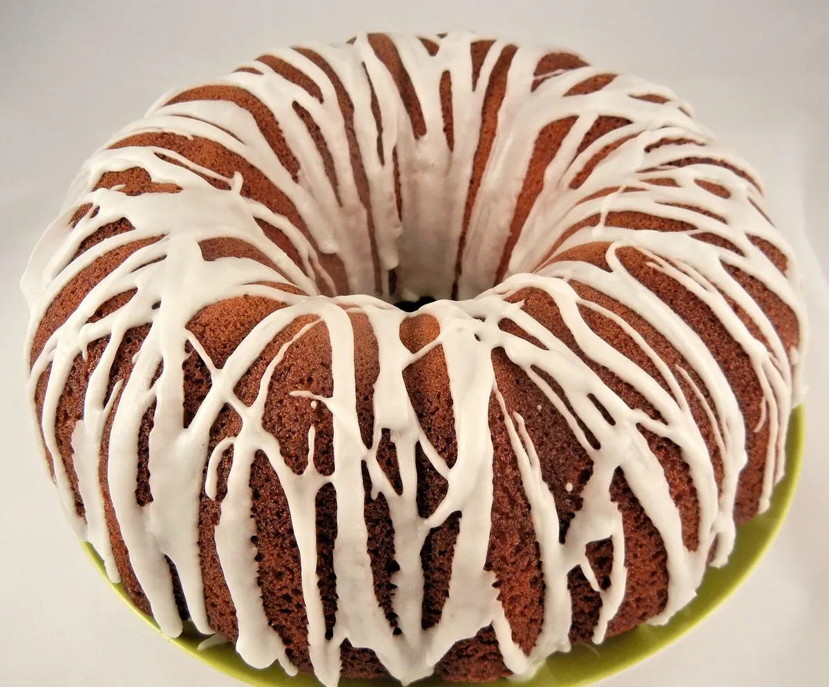 Golden Bundt cake drizzled with white vanilla glaze, similar to a Southern sock it to me cake