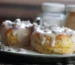 Split biscuits covered in thick creamy white gravy with meat, similar to creamed chipped beef served over biscuits