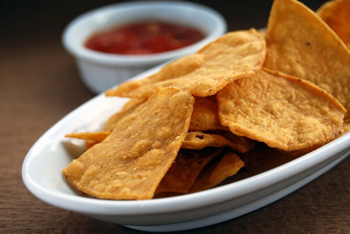 Crispy tortilla chips and salsa to crumble over a bowl of enchilada soup