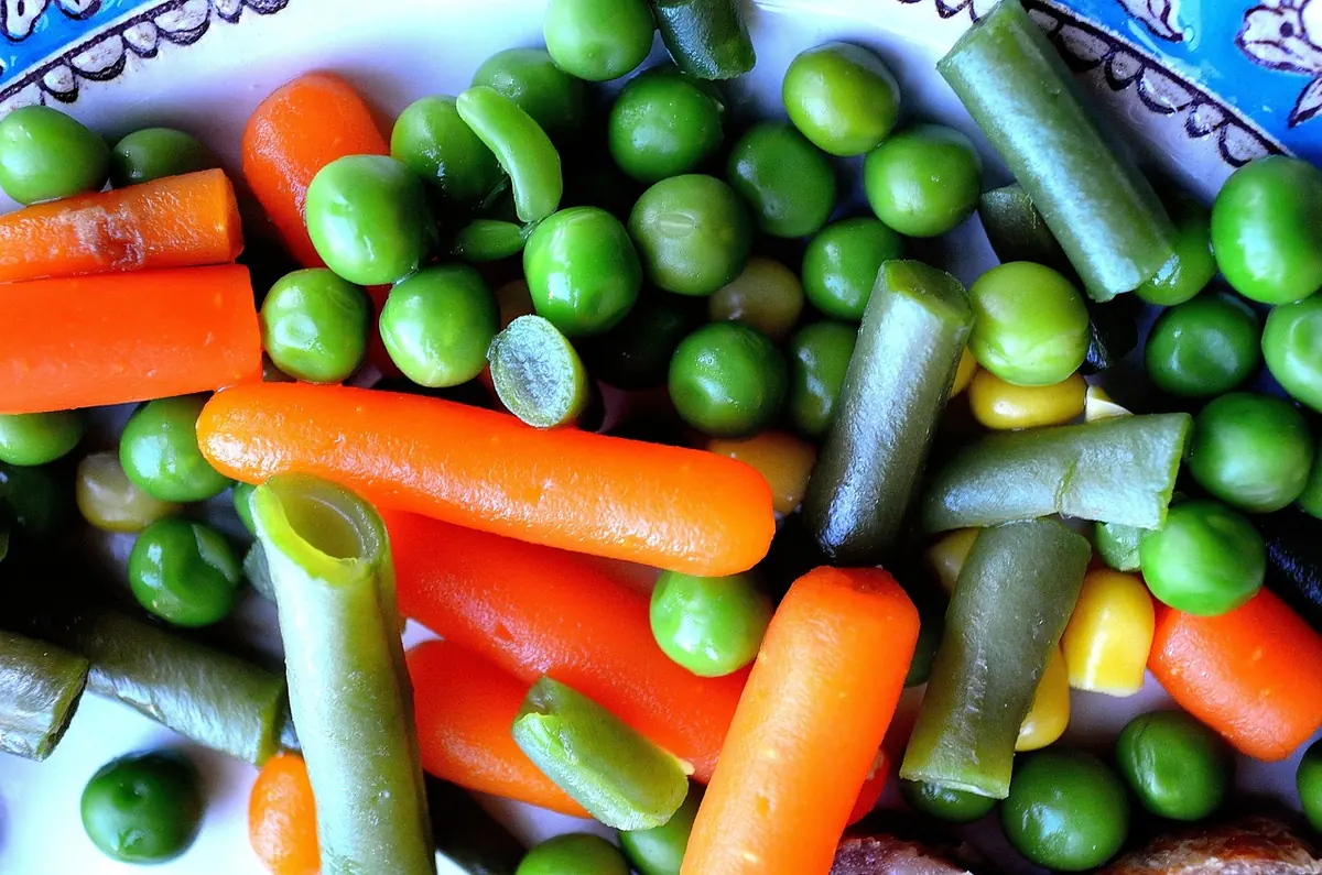 Frozen mixed vegetables with peas, carrots, green beans and corn, ready to layer over the chicken