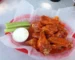 Buffalo wings with celery sticks and ranch, the flavors behind this buffalo chicken dip