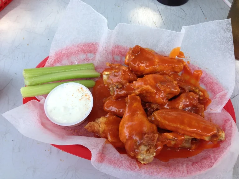 Buffalo wings with celery sticks and ranch, the flavors behind this buffalo chicken dip