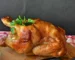 Golden roast chicken with parsley on a wooden board, juicy after a chicken brine