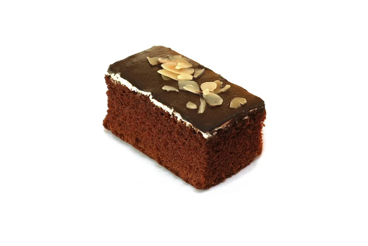 Frosted square of chocolate cake with sliced almonds, the kind of piece this easy chocolate cake recipe makes in a 9x13 pan