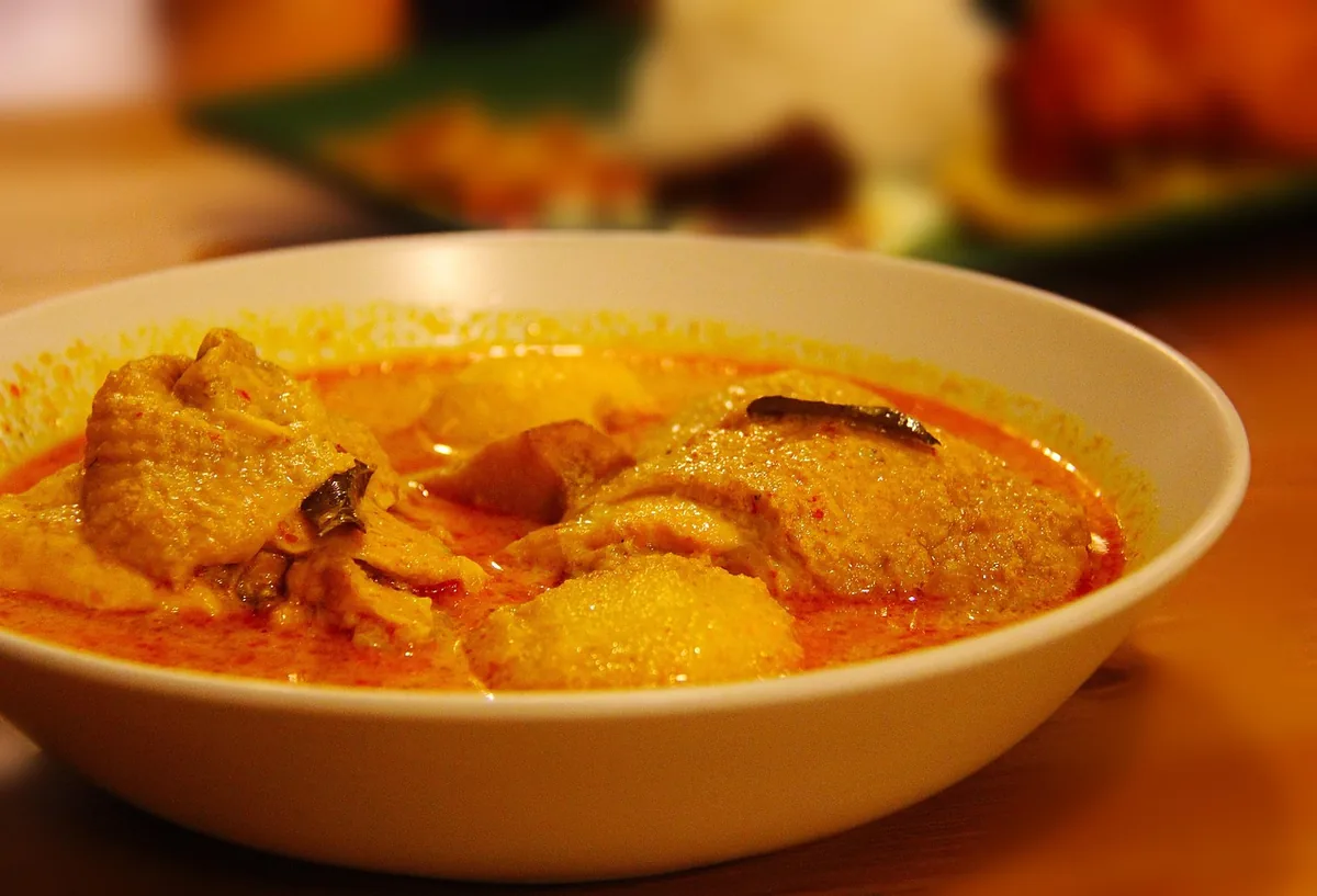 Chicken curry with pieces of potato in a golden coconut gravy