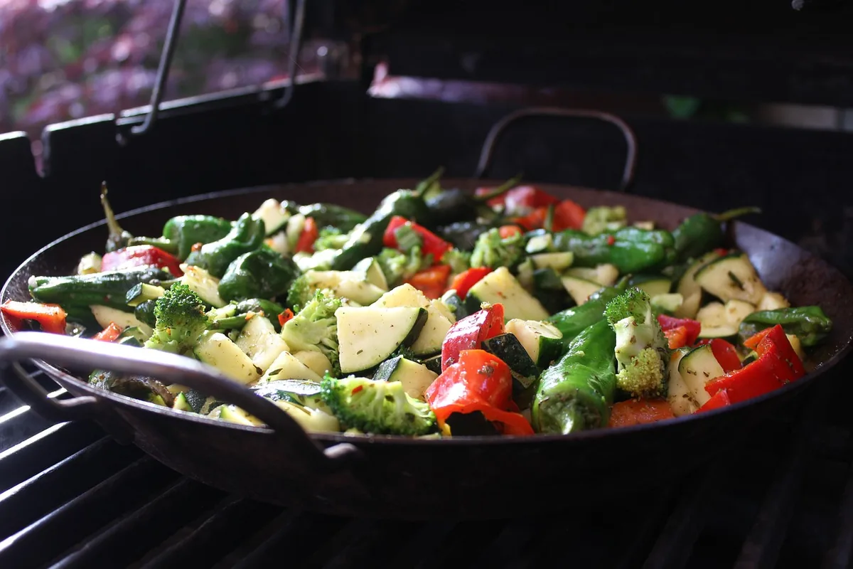 Pan of roasted zucchini, broccoli, peppers and green beans